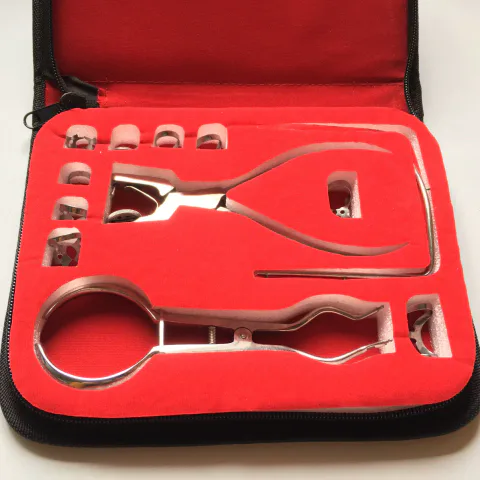 Rubber dam punch, clamp forceps and clamps