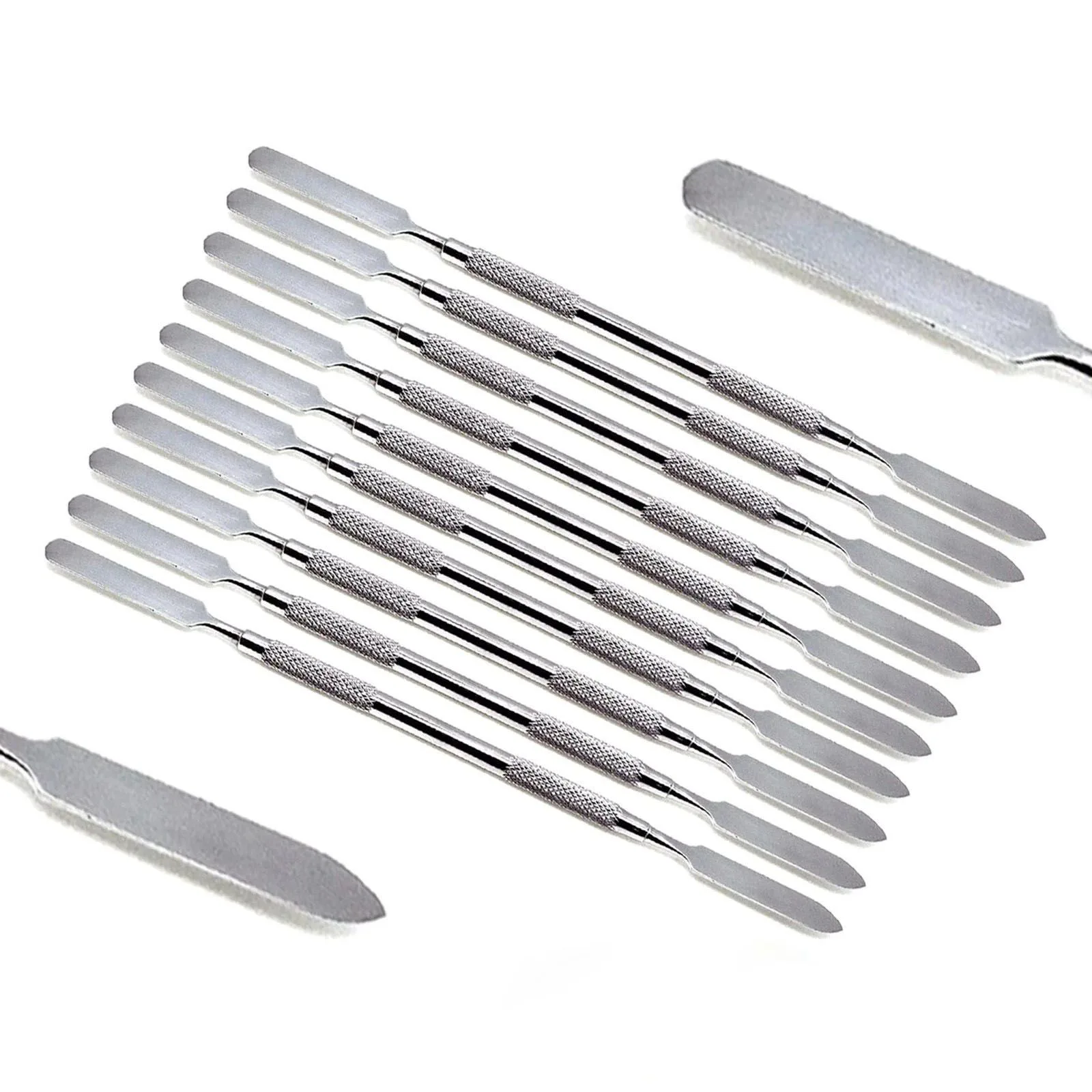 Double-ended dental cement spatulas with enlarged blade-profile details