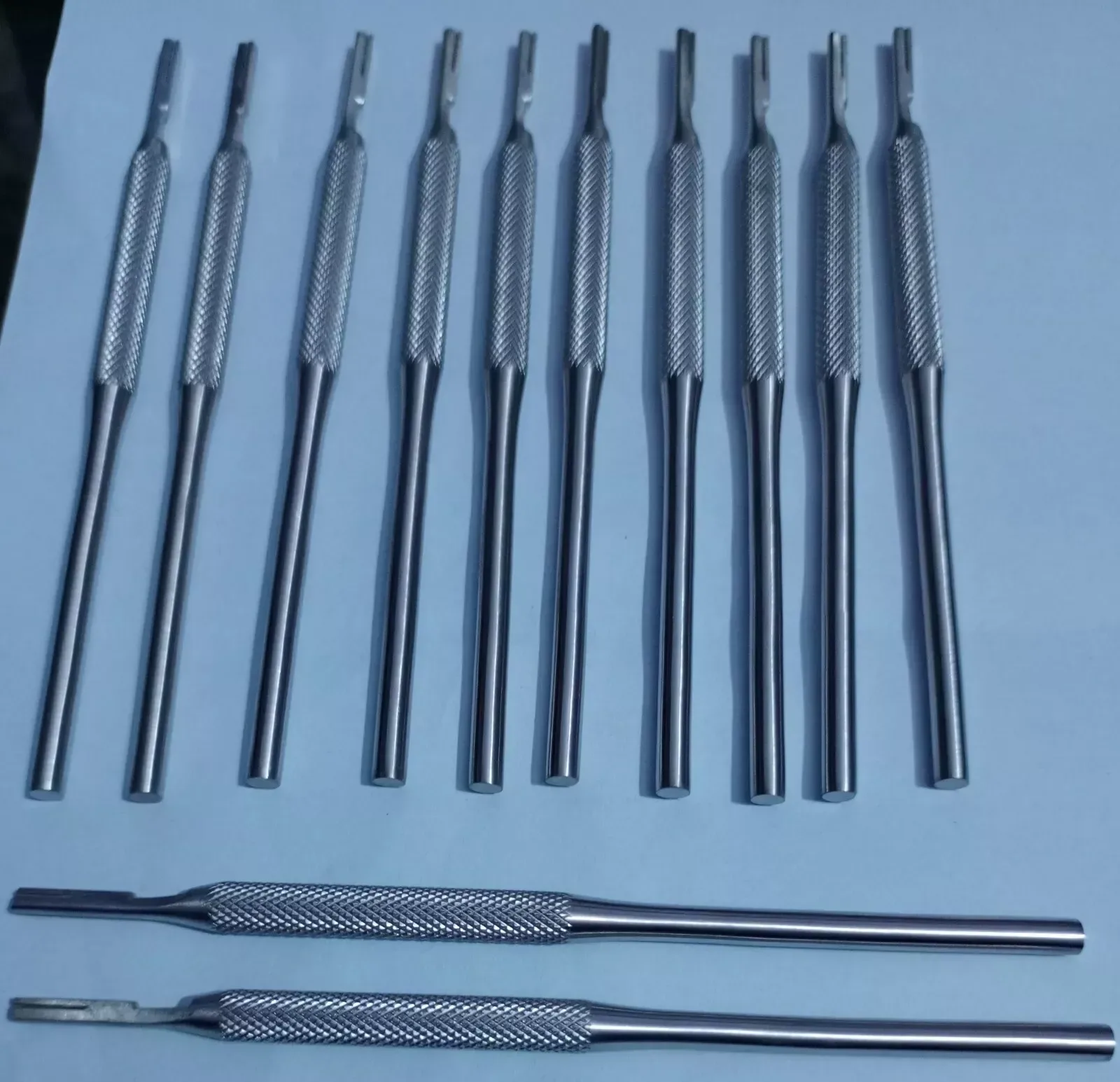 Round knurled dental scalpel handles without blades — view 1